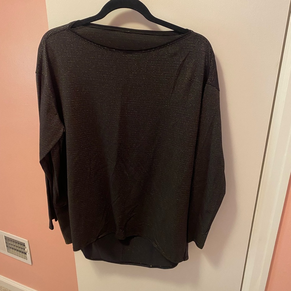 Lululemon back in action gold and black striped. Tags removed but never worn